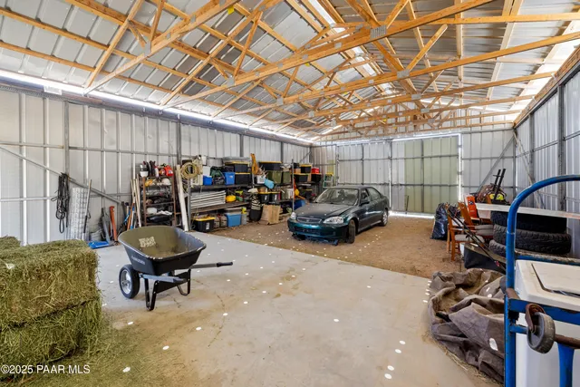 a view of a garage with a table and chairs