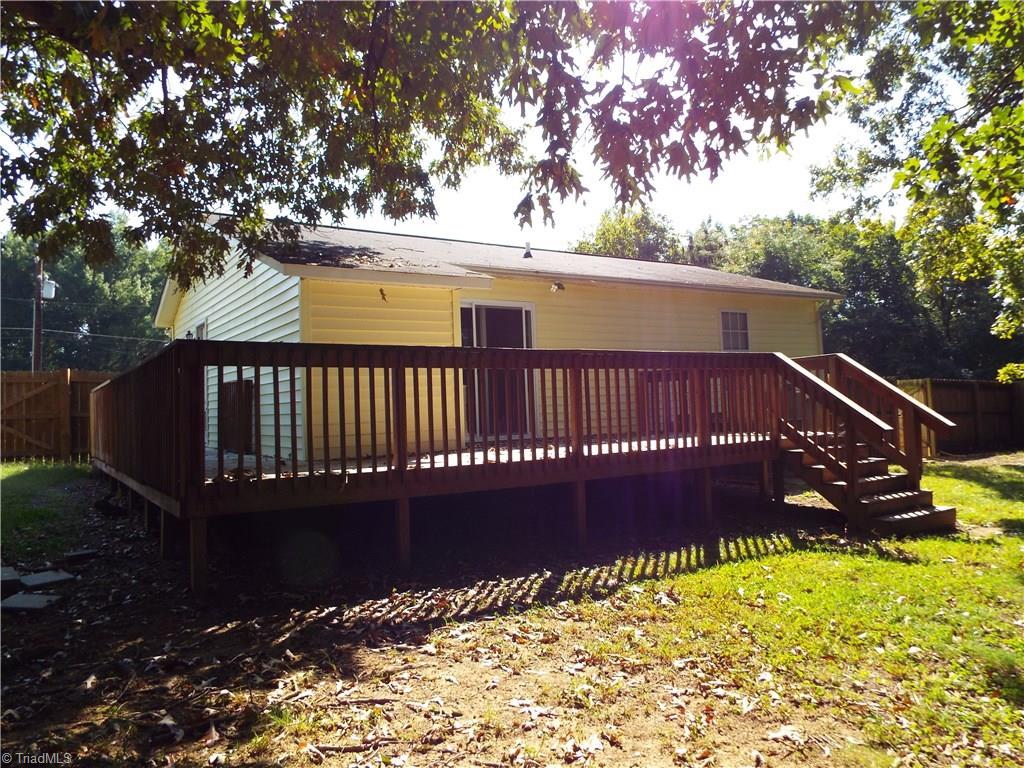 113 Foust Road Graham, NC 27253 - Photo 4 of 16 Large deck on two sides.