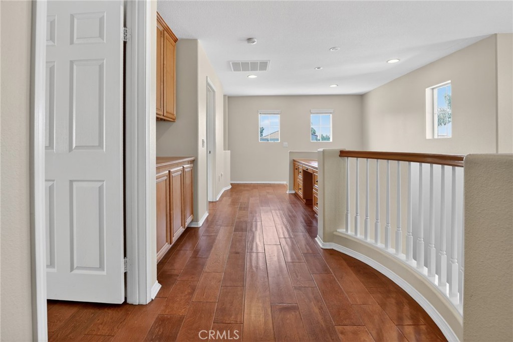 20543 Pesaro Porter Ranch Porter Ranch, CA 91326 - Photo 29 of 67 a view of a hallway with wooden floor and staircase