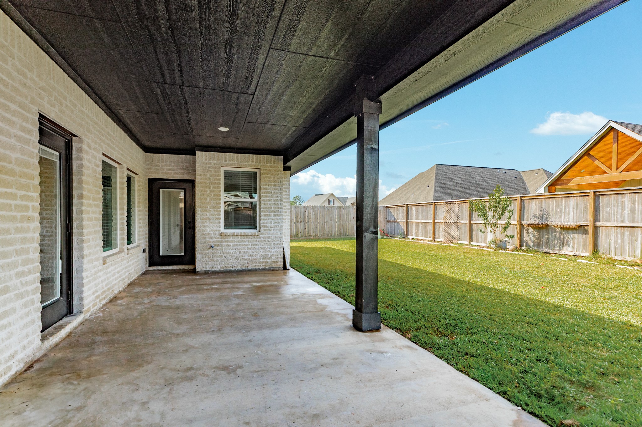 2 Greystone Court Angleton, TX 77515 - Photo 33 of 34 a view of a house with backyard and porch