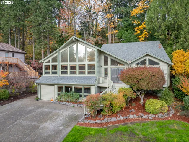 a front view of house with yard and green space