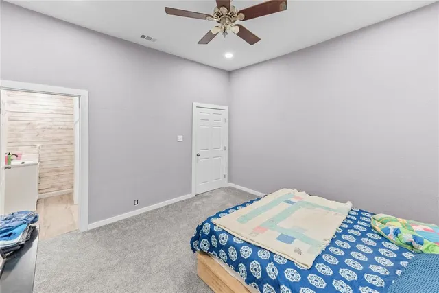 a bedroom with bed and a window