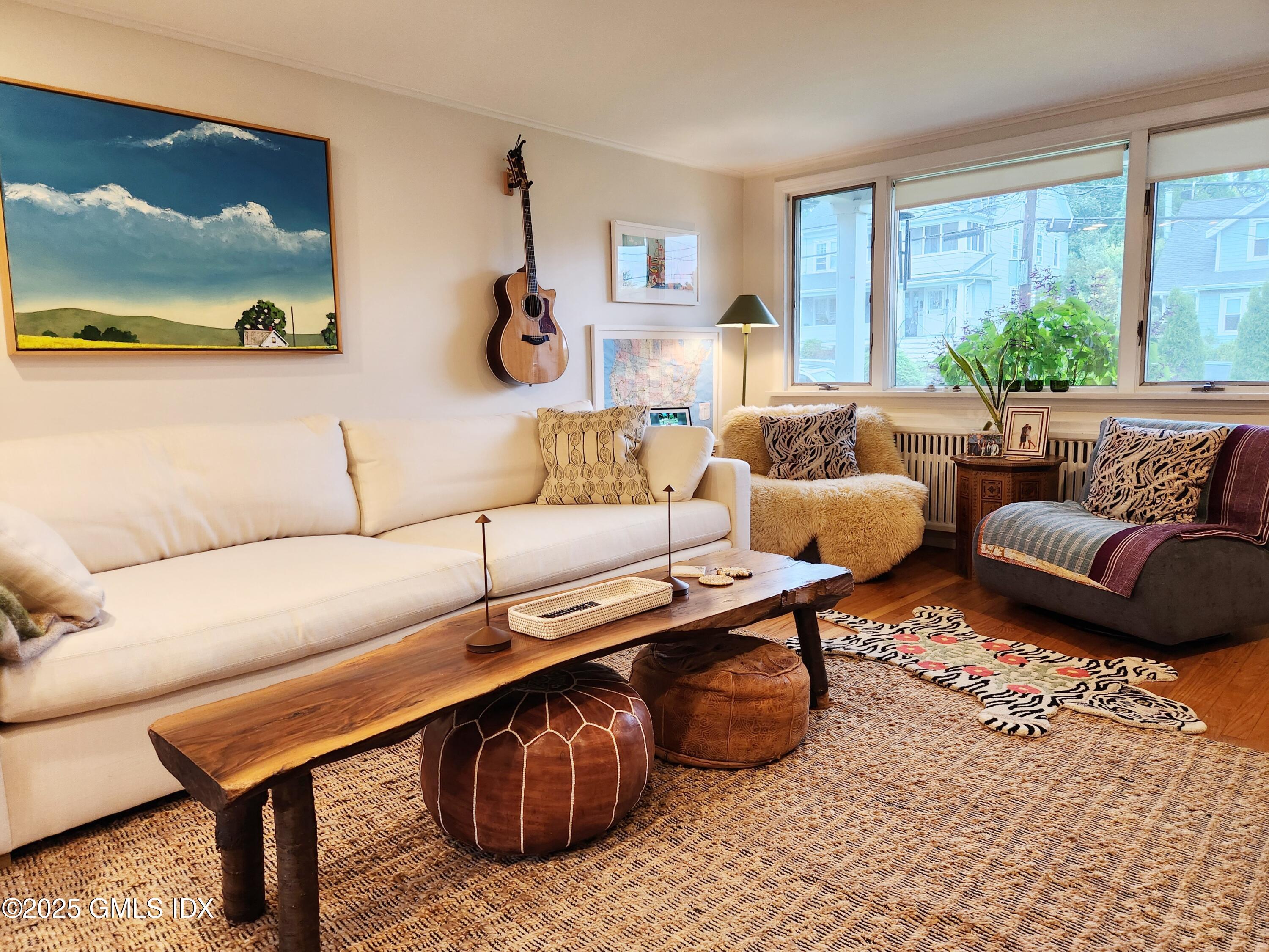 13 High Street Greenwich, CT 06830 - Photo 14 of 29 a living room with furniture and a large window