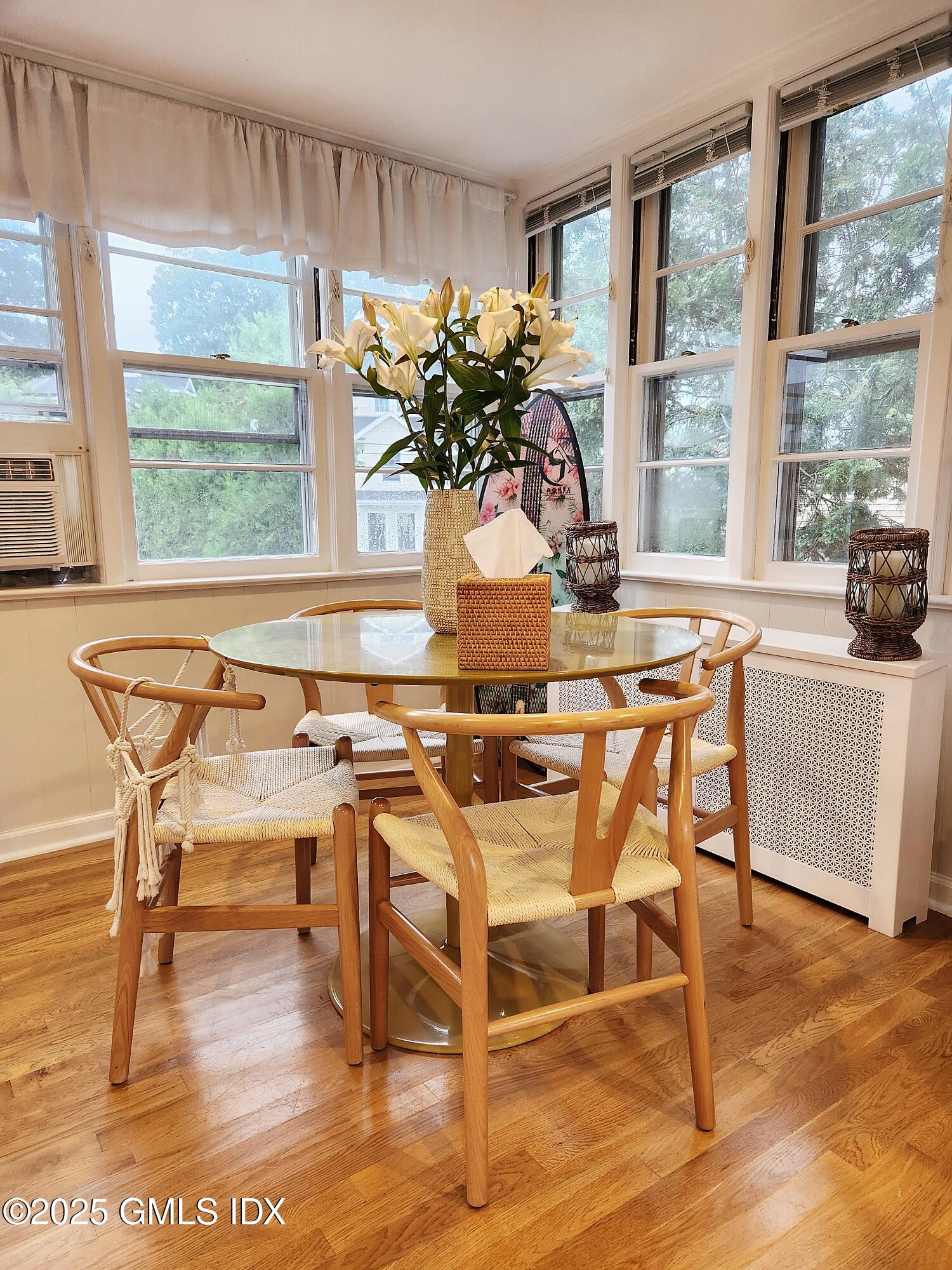 13 High Street Greenwich, CT 06830 - Photo 15 of 29 a view of a dining room with furniture window and wooden floor