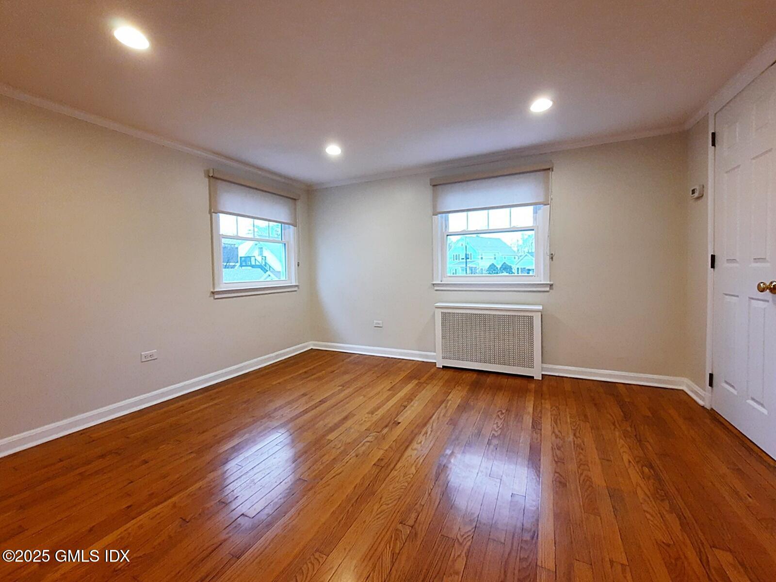 13 High Street Greenwich, CT 06830 - Photo 21 of 29 an empty room with wooden floor and windows
