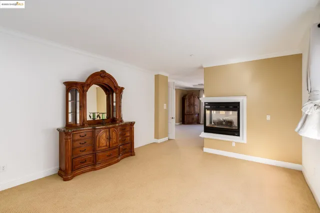 a bedroom with a bed and large window