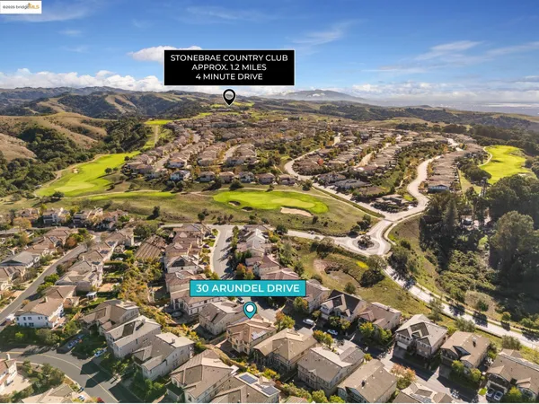 an aerial view of residential building with parking