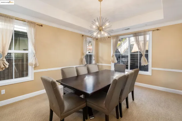 a view of a dining room with furniture window and outside view