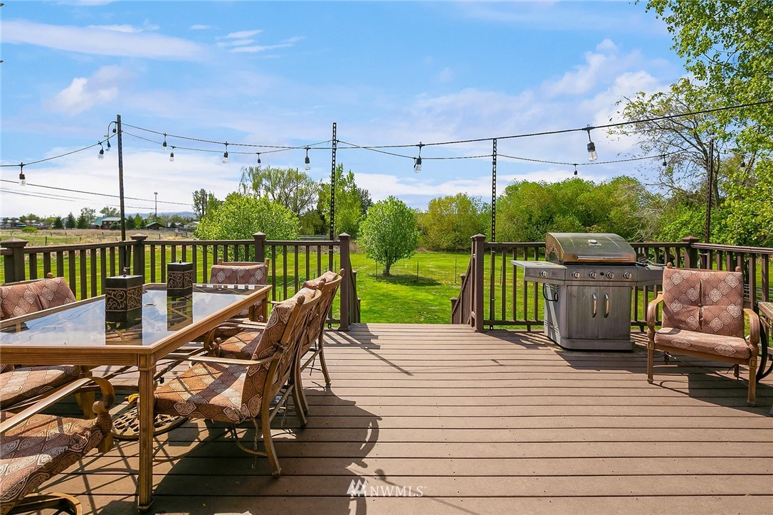 1714 Radio Road Ellensburg, WA 98926 - Photo 14 of 30 a view of a deck with wooden floor and outdoor seating