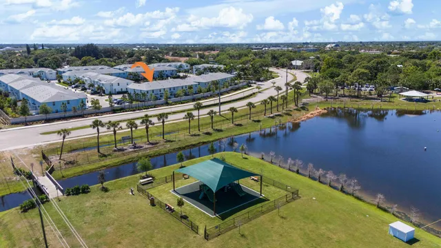 a view of a swimming pool with lawn chairs