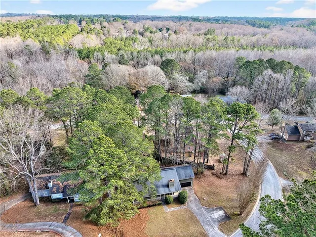 a view of a garden with an outdoor seating