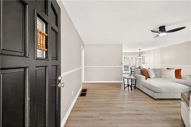 a bedroom with furniture and a wooden floor