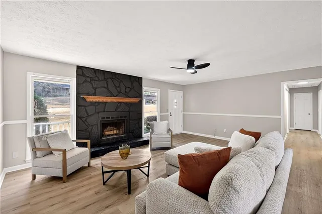 a living room with furniture and a fireplace