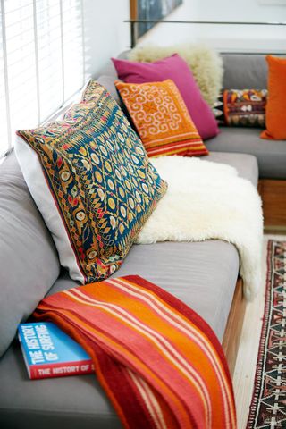 a bedroom with a bed and a couch