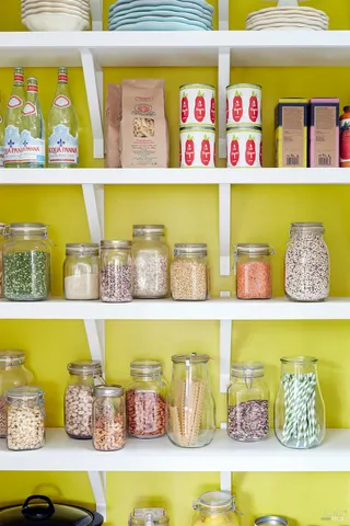 a bathroom with a bathtub and shelf