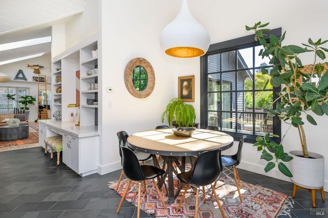 a view of a chairs and table in a room