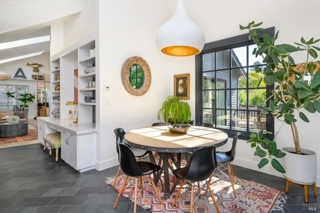 a view of a chairs and table in a room