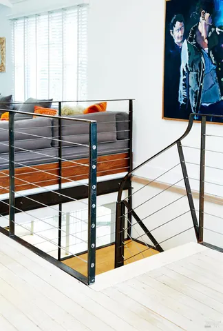 a bed room with a bed and a chair