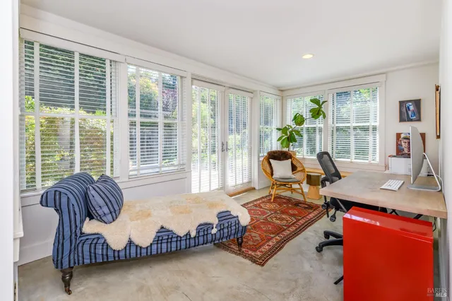a view of entryway with furniture and wooden floor