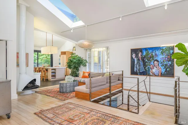 a living room with furniture and a rug