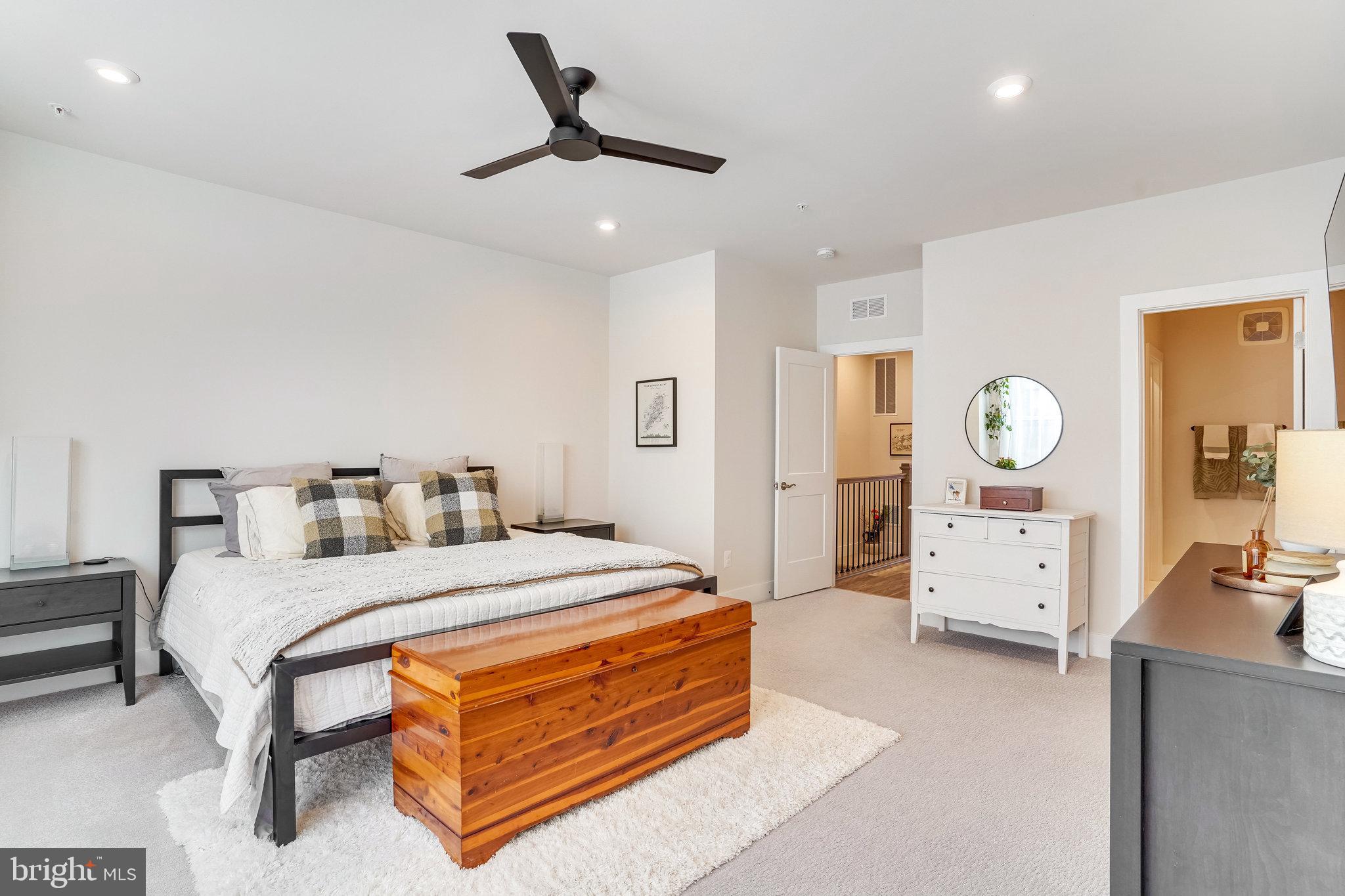 1660 Bandit Loop Reston, VA 20190 - Photo 14 of 39 a bedroom with a bed and dresser