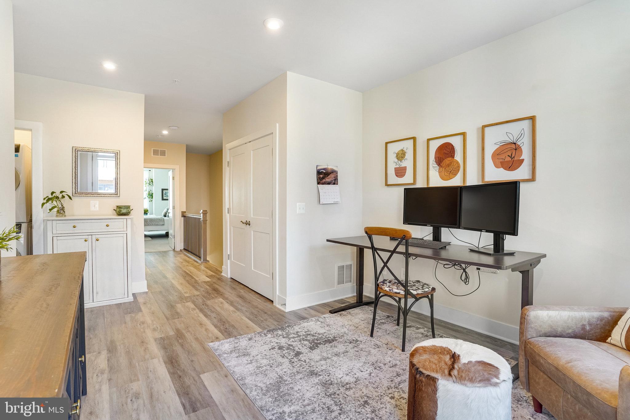 1660 Bandit Loop Reston, VA 20190 - Photo 18 of 39 a living room with furniture and a flat screen tv
