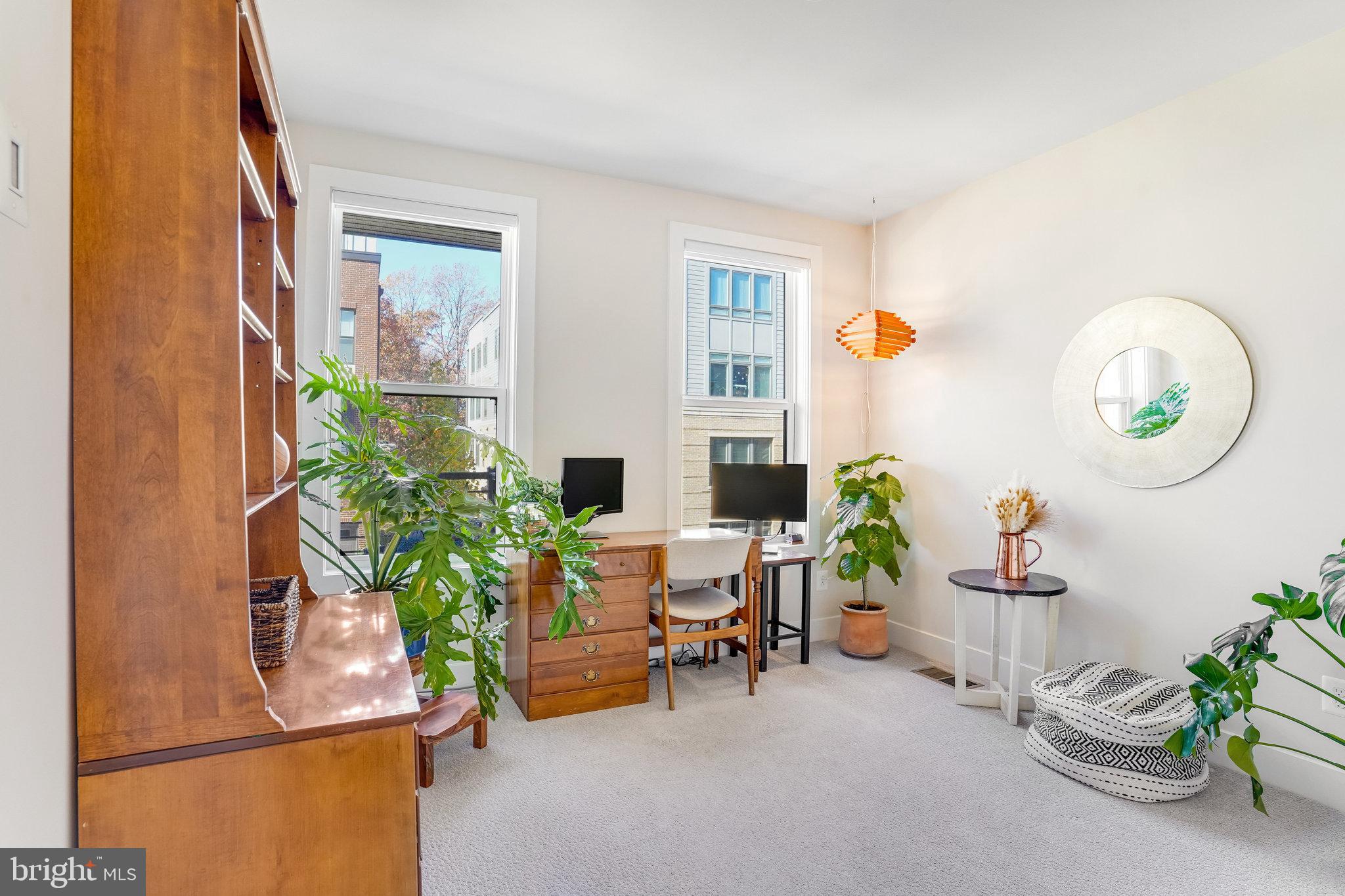 1660 Bandit Loop Reston, VA 20190 - Photo 19 of 39 a living room with furniture and a potted plant