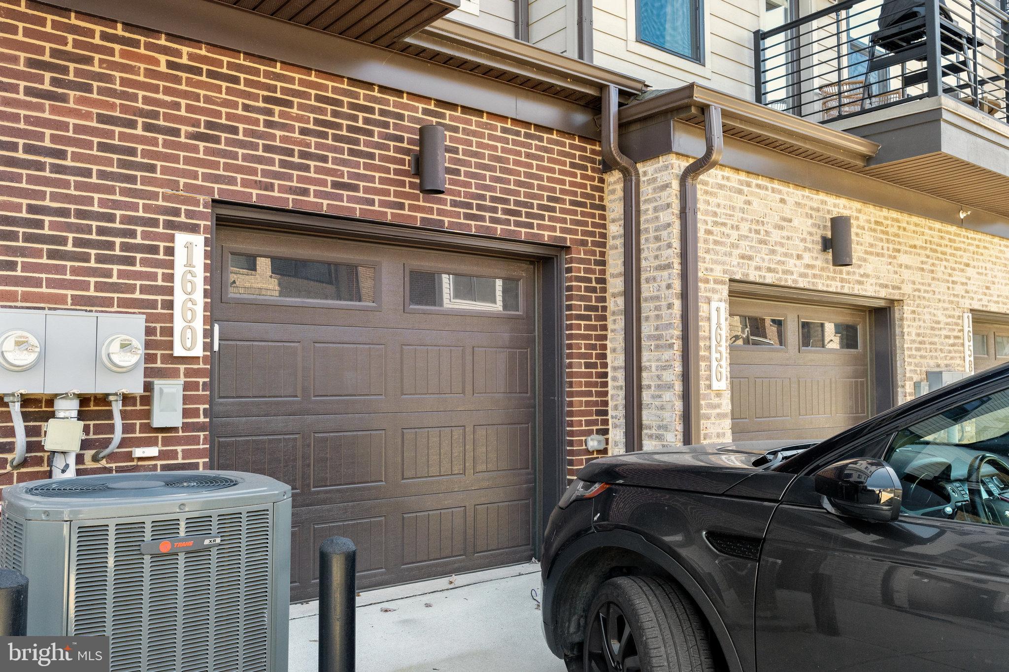 1660 Bandit Loop Reston, VA 20190 - Photo 26 of 39 a front view of a house with a garage