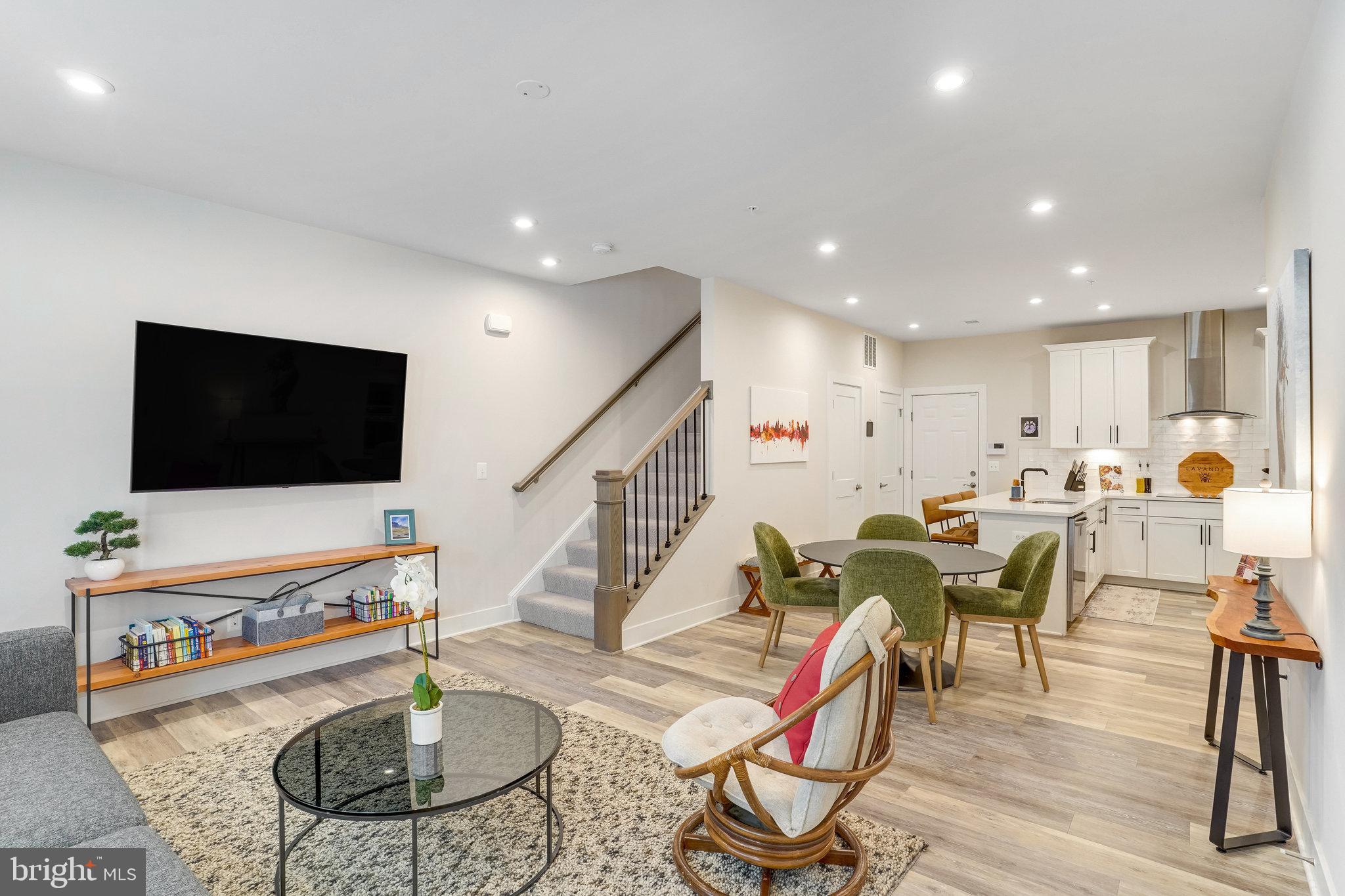 1660 Bandit Loop Reston, VA 20190 - Photo 4 of 39 a living room with furniture and a flat screen tv