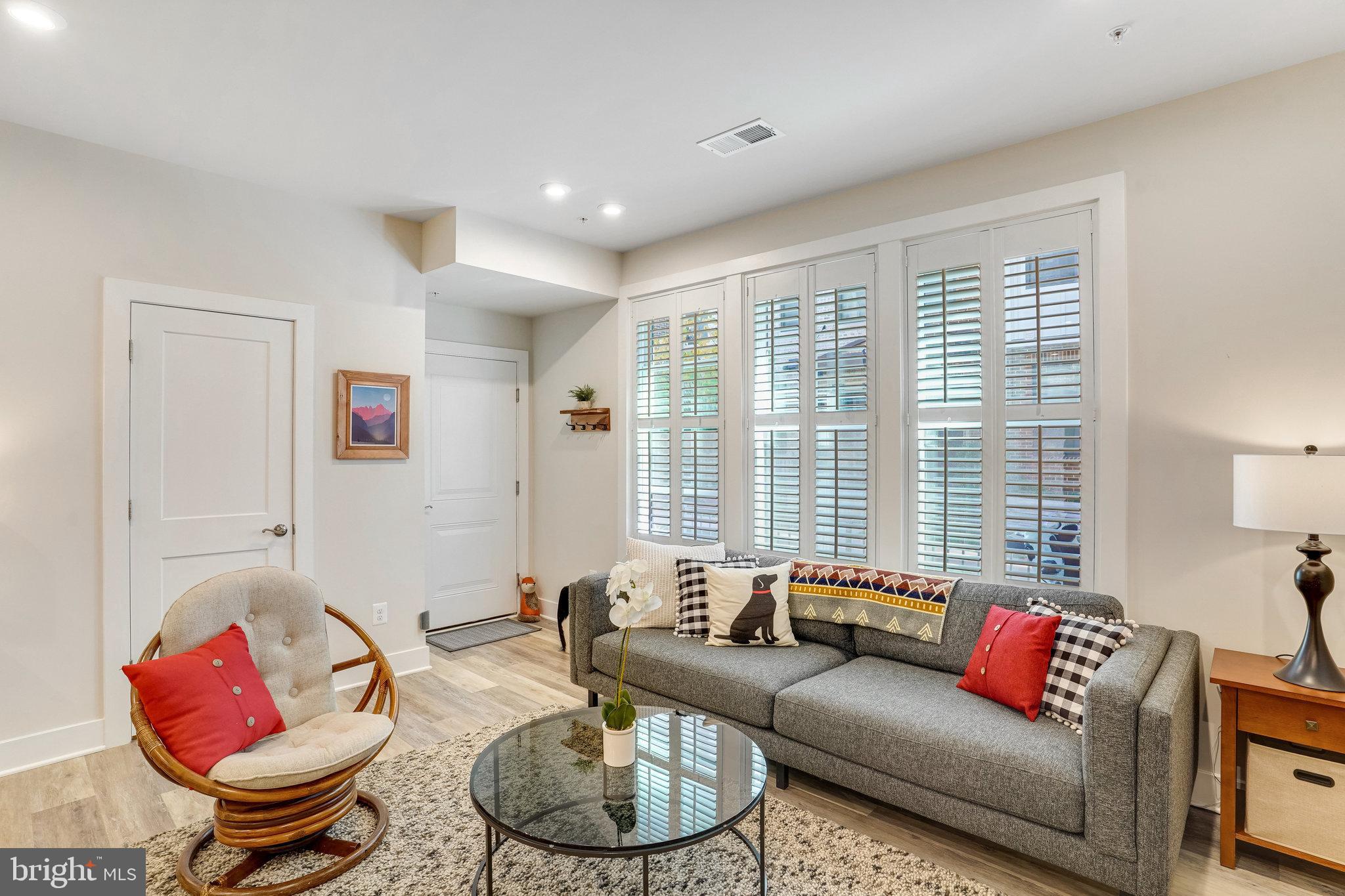 1660 Bandit Loop Reston, VA 20190 - Photo 5 of 39 a living room with furniture and a large window