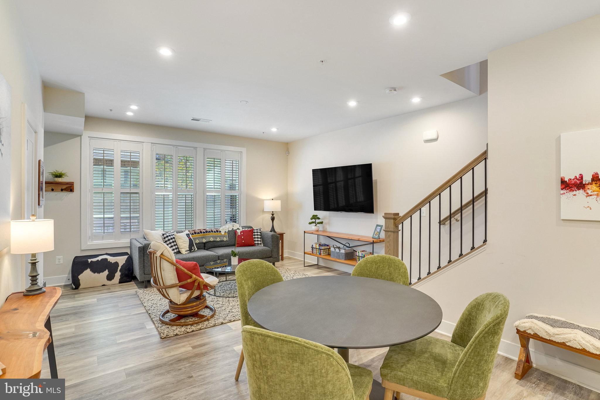 1660 Bandit Loop Reston, VA 20190 - Photo 7 of 39 a living room with furniture and a flat screen tv