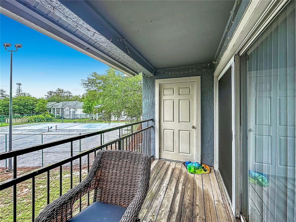 3705 Southwest 27th Street, Unit 922 Gainesville, FL 32608 - Photo 28 of 34 a view of balcony with wooden floor