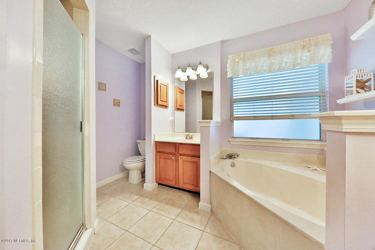 757 MacKenzie Circle St. Augustine, FL 32092 - Photo 17 of 31 a bathroom with a bathtub sink and toilet