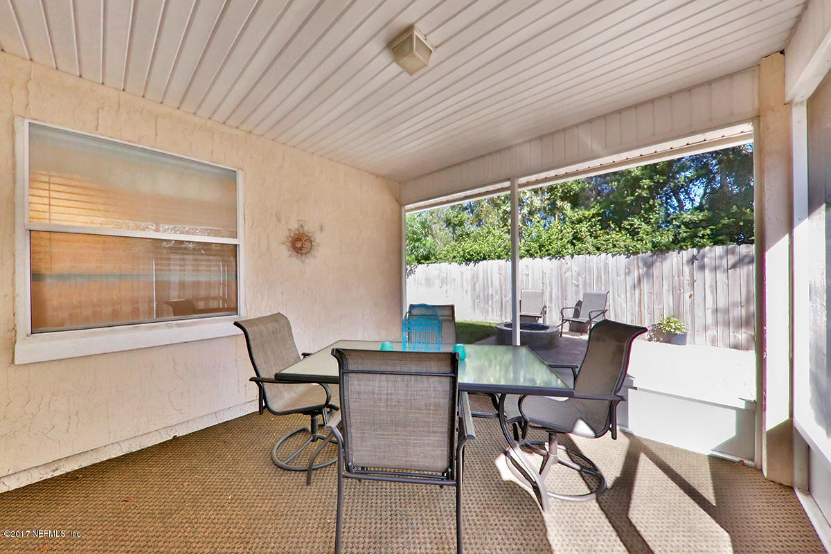 757 MacKenzie Circle St. Augustine, FL 32092 - Photo 28 of 31 a view of a dining room with furniture window and outside view