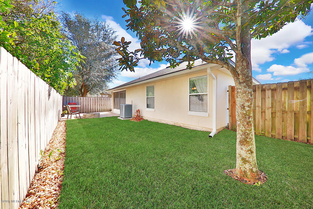 757 MacKenzie Circle St. Augustine, FL 32092 - Photo 29 of 31 a front view of house with yard