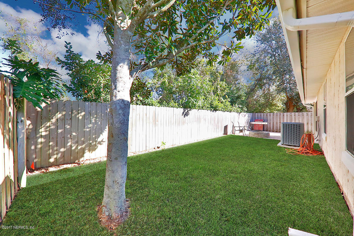 757 MacKenzie Circle St. Augustine, FL 32092 - Photo 30 of 31 a view of a backyard with a tree