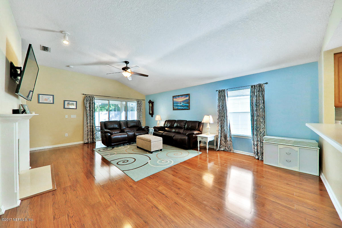 757 MacKenzie Circle St. Augustine, FL 32092 - Photo 4 of 31 a living room with furniture and a wooden floor