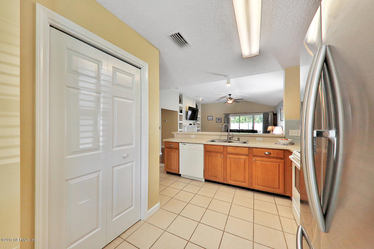 757 MacKenzie Circle St. Augustine, FL 32092 - Photo 8 of 31 a kitchen with stainless steel appliances granite countertop a refrigerator and a sink
