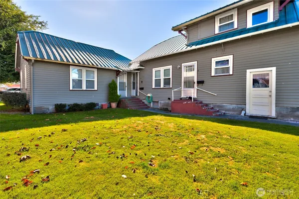 a front view of house with yard and patio