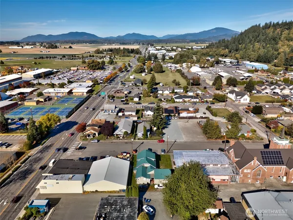 an aerial view of residential houses with outdoor space