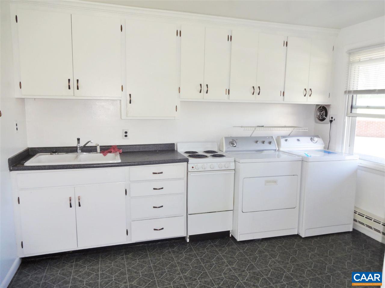 121 Abe Road Ruckersville, VA 22968 - Photo 11 of 28 a kitchen with white cabinets and white appliances