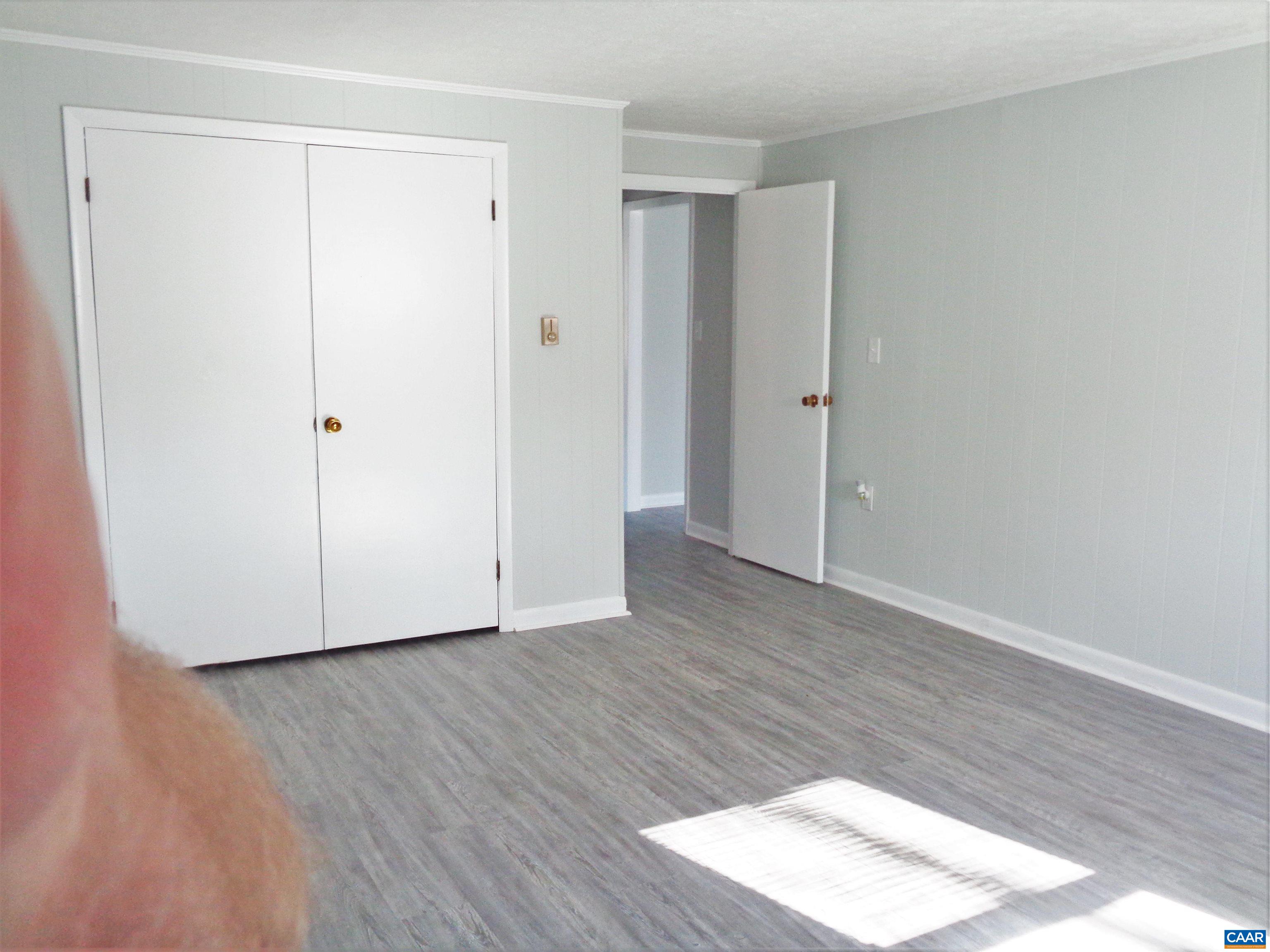 121 Abe Road Ruckersville, VA 22968 - Photo 15 of 28 a view of an empty room with wooden floor