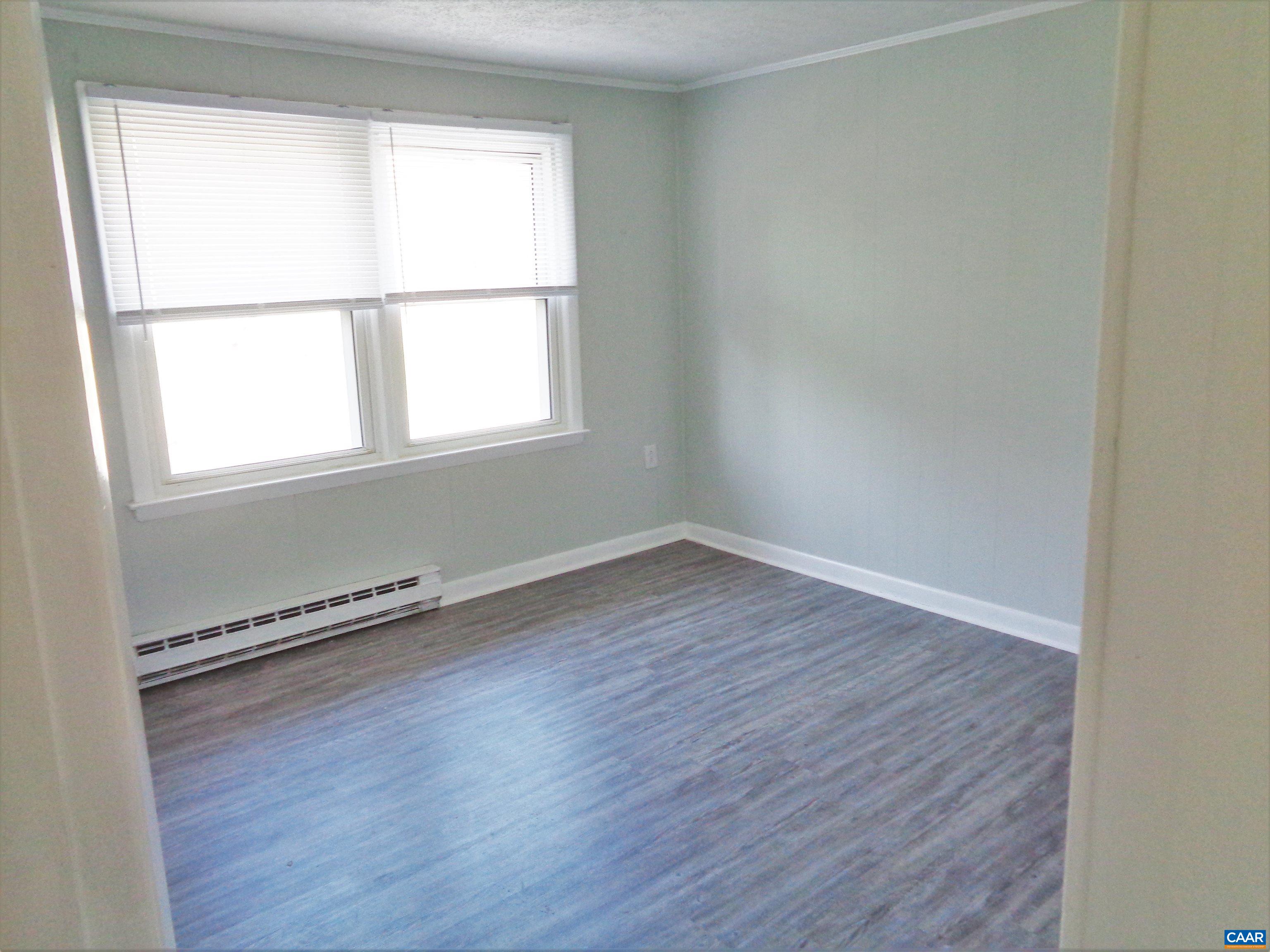 121 Abe Road Ruckersville, VA 22968 - Photo 16 of 28 an empty room with wooden floor and windows