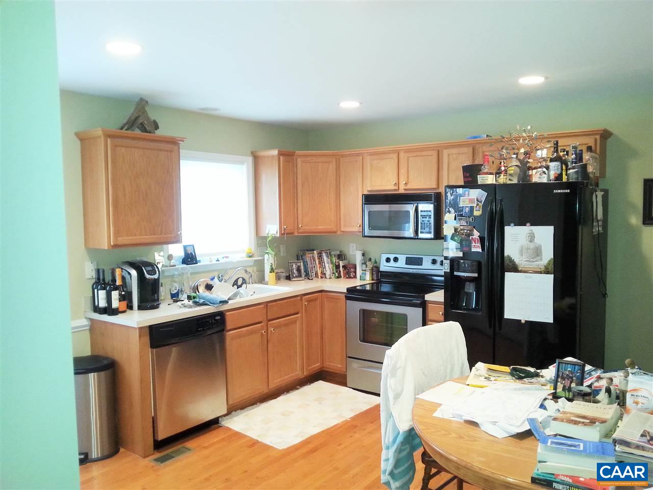 121 Abe Road Ruckersville, VA 22968 - Photo 22 of 28 a kitchen with granite countertop a sink appliances and cabinets
