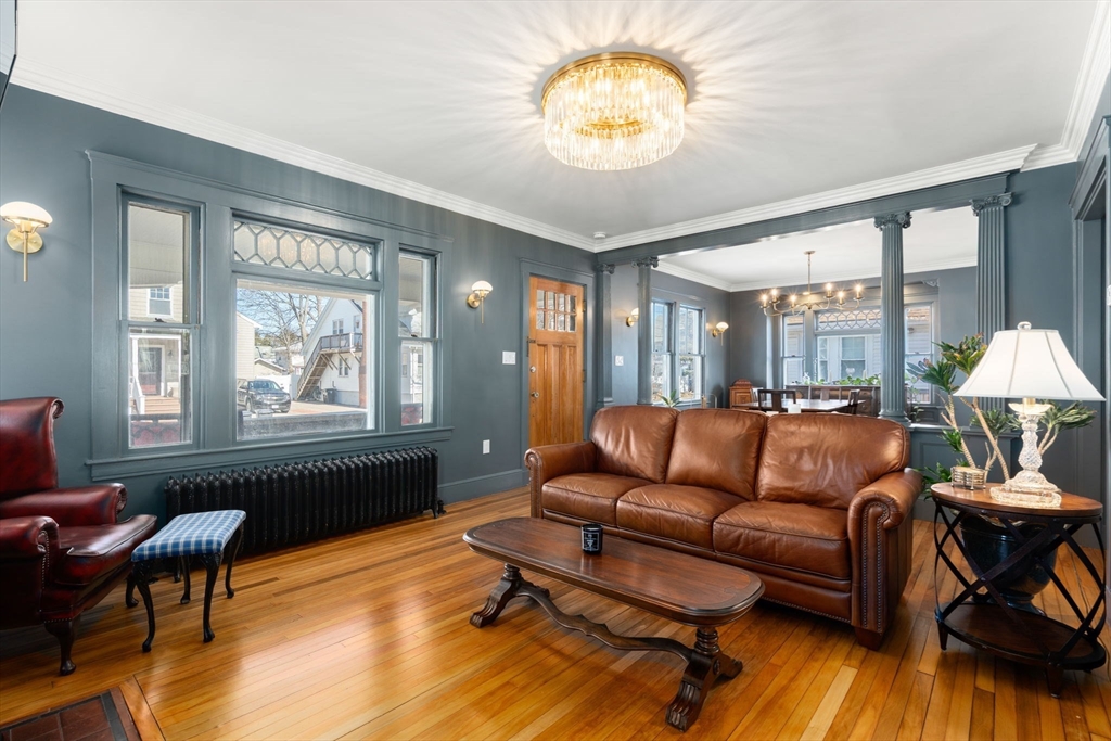 271 Atlantic Street Quincy, MA 02171 - Photo 12 of 24 a living room with furniture and a large window