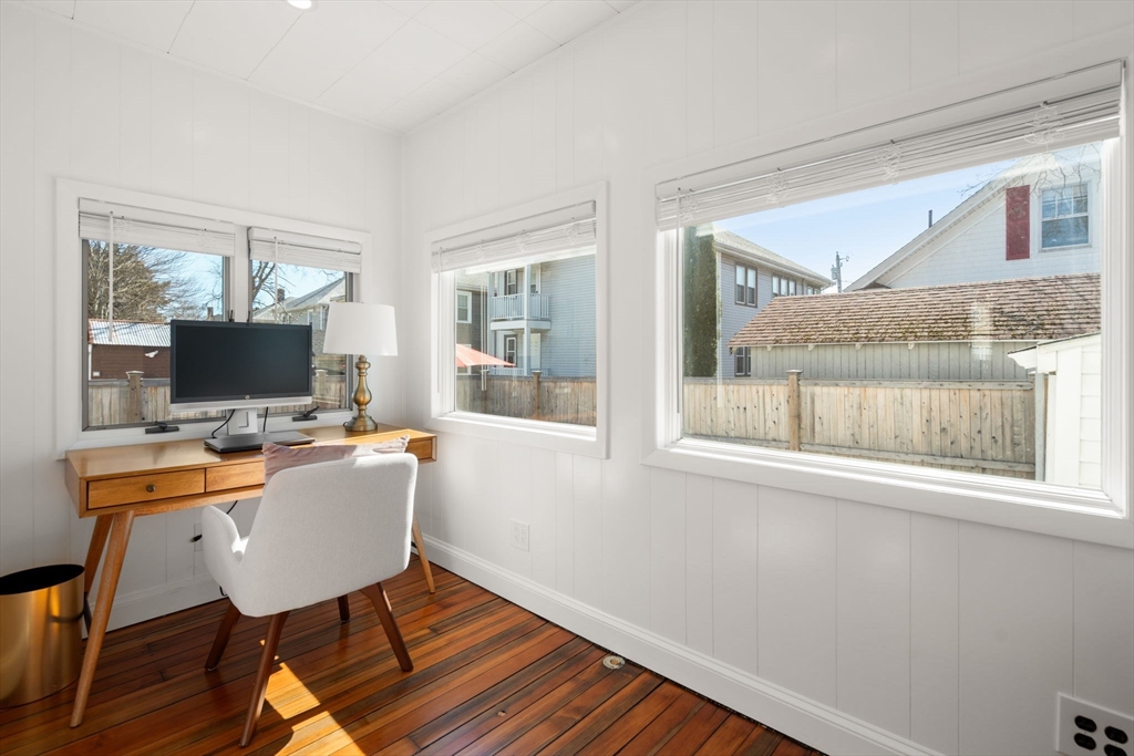 271 Atlantic Street Quincy, MA 02171 - Photo 22 of 24 a view of a workspace with furniture window and wooden floor