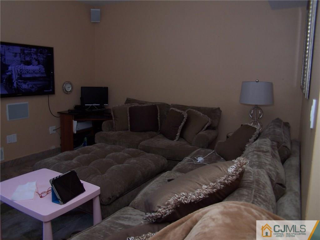 6 Nutmeg Road Aberdeen, NJ 07747 - Photo 11 of 24 a living room with furniture and a couch