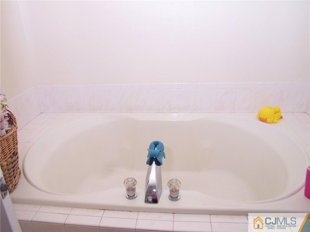 6 Nutmeg Road Aberdeen, NJ 07747 - Photo 17 of 24 a bathroom with a sink