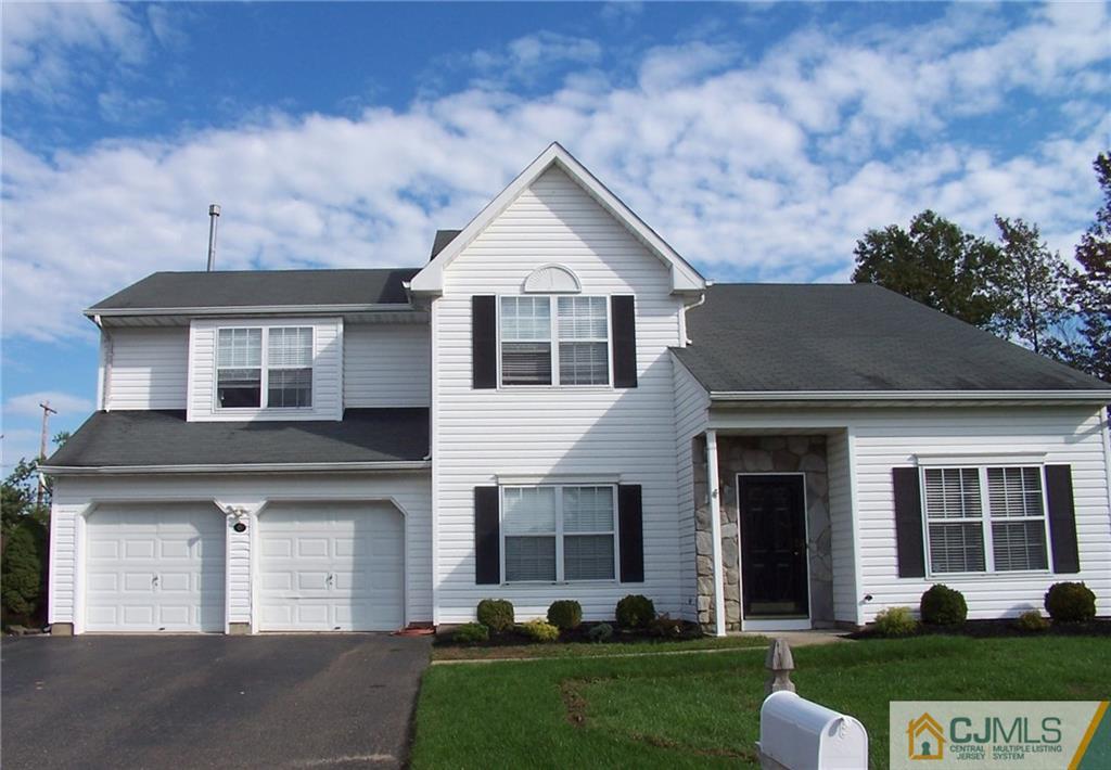 6 Nutmeg Road Aberdeen, NJ 07747 - Photo 24 of 24 a front view of a house with a yard and garage