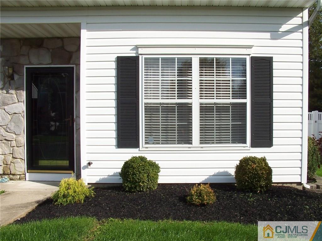 6 Nutmeg Road Aberdeen, NJ 07747 - Photo 5 of 24 a front view of a house with garden